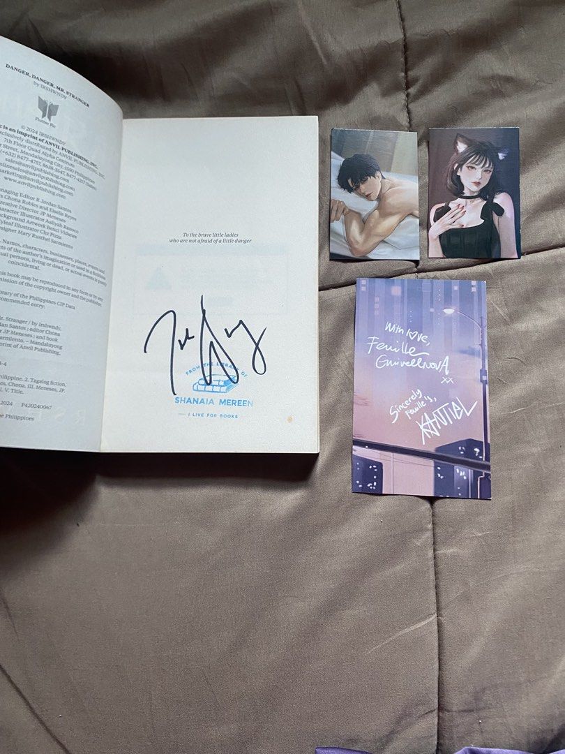 SIGNED Danger, Danger Mr. Stranger by Irshwndy - Signed (Category: Storybooks) located in Caloocan City. Submitted by lienzonius (Listing ID 1459114424, Image 2). Description: - Book Title: Danger, Danger Mr. Stranger - Author: Irshwndy - Special Features: Includes cyber inserts and a signed page - Condition: Good - Extras: Comes with two character art cards - Ideal for: Fans of the author.