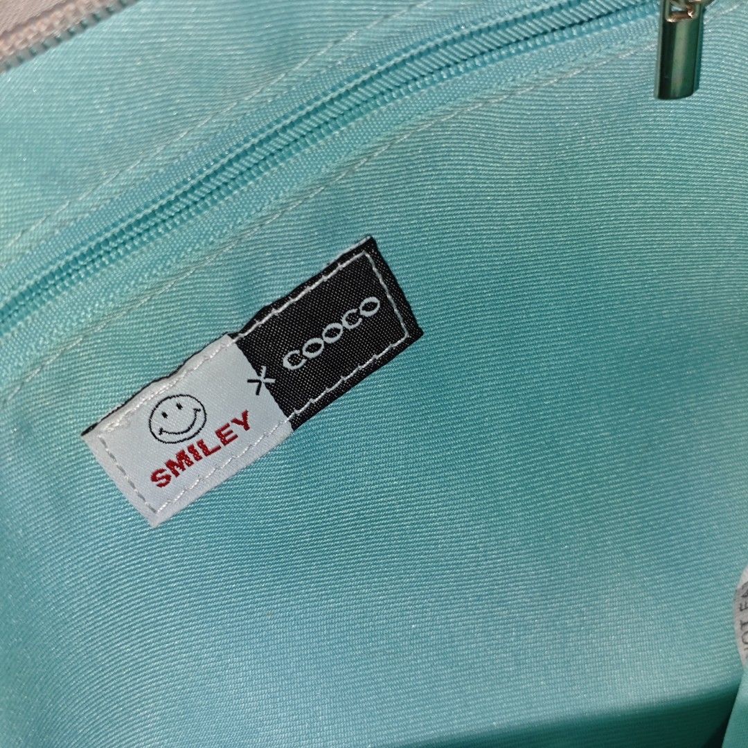 Smiley X Cooco Gray Clutch Bag (Category: Clutches) located in Tanay. Submitted by polothriftedit (Listing ID 1459123787, Image 3). Description: No issue Excellent condition No loose stitches, no distressing no return, no exchange, no refund [ pwede tumawad kahit walang kasalanan ].