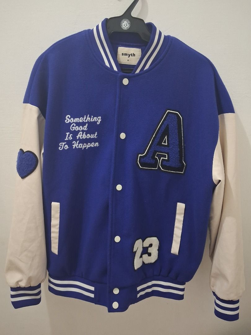 Smyth Blue & Cream Varsity Jacket 'A' Patch (Category: Coats, Jackets and Outerwear) located in Caloocan City. Submitted by zaneulysses (Listing ID 1459137639, Image 1). Description: - Cool Smyth varsity jacket - Blue body with cream sleeves - Embroidered 'A' patch and '23' on the front - Cute heart patch on the left sleeve - Ribbed cuffs and hem - Button-up front.