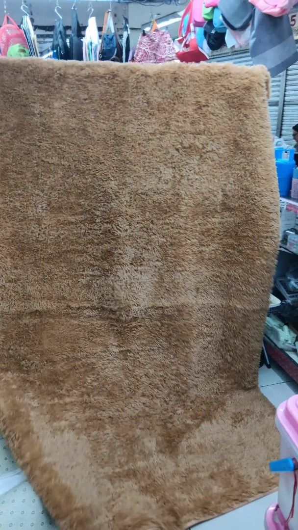 Soft Plush Brown Carpet Rug (Category: Carpets, Mats & Flooring) located in Caloocan City. Submitted by swiftflower_802790 (Listing ID 1459189397, Image 1). Description: - Super soft and fluffy brown rug - Adds warmth and comfort to any room - Plush texture feels amazing underfoot - Easy to clean and maintain - Perfect for living rooms, bedrooms, or play areas - Creates a cozy vibe.