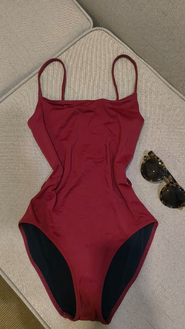 Solid & Striped One Piece Swimsuit with Belt (Category: Bikinis & Swimsuits) located in Makati City. Submitted by fashion_thrift_ (Listing ID 1459288870, Image 2). Description: Maroon one-piece swimsuit from Solid & Striped. Comes with a matching belt that has a circular buckle. The belt has black stripes and button details. Straps are thin spaghetti straps. Back is a racerback style. Great for the beach or pool..