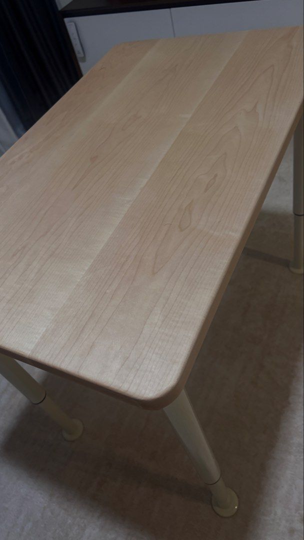 Adjustable Table - Solid Wood (Category: Tables & Sets) located in Singapore. Submitted by hello_panda89 (Listing ID 1459201143, Image 2). Description: Minimalist solid oak wood table with adjustable white legs. Perfect for small spaces, study, or as a side table. Easy to move. Almost like new as it is extra in my house, only used as sofa side table. No damage at all. Dimension (Length and Width) : 80cmx50cm Height: Come with 4 adjustable legs (4
