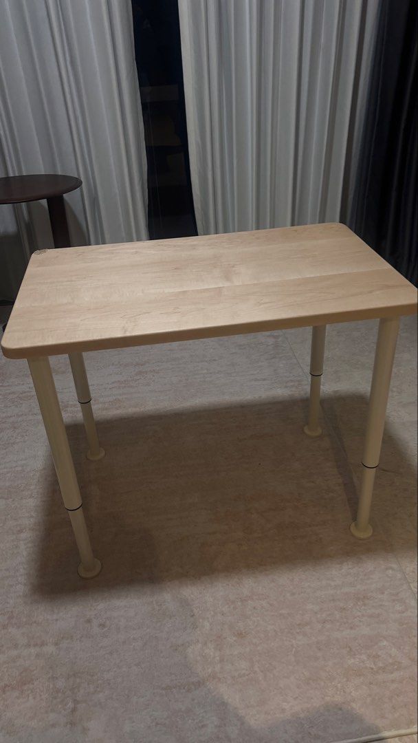 Adjustable Table - Solid Wood (Category: Tables & Sets) located in Singapore. Submitted by hello_panda89 (Listing ID 1459201143, Image 1). Description: Minimalist solid oak wood table with adjustable white legs. Perfect for small spaces, study, or as a side table. Easy to move. Almost like new as it is extra in my house, only used as sofa side table. No damage at all. Dimension (Length and Width) : 80cmx50cm Height: Come with 4 adjustable legs (4