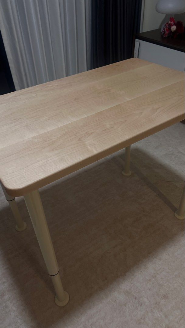 Adjustable Table - Solid Wood (Category: Tables & Sets) located in Singapore. Submitted by hello_panda89 (Listing ID 1459201143, Image 3). Description: Minimalist solid oak wood table with adjustable white legs. Perfect for small spaces, study, or as a side table. Easy to move. Almost like new as it is extra in my house, only used as sofa side table. No damage at all. Dimension (Length and Width) : 80cmx50cm Height: Come with 4 adjustable legs (4