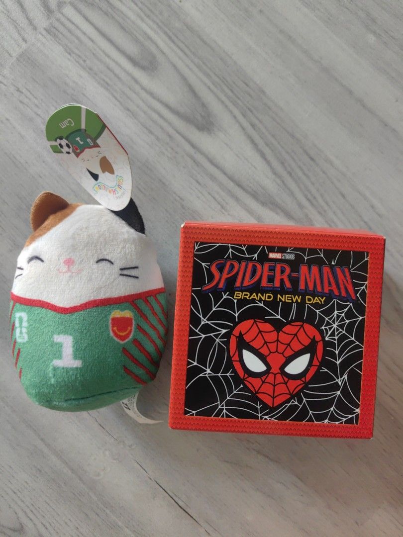 Squishmallows & Spider-Man (Category: Plushies & Soft Toys) located in Manila. Submitted by zyryx.18 (Listing ID 1459103981, Image 1). Description: - Squishmallows Cam the Cat plush toy (soccer player version) - Spiderman themed toy camera - Ideal gift for Squishmallows and Spiderman fans - rfs: need money..