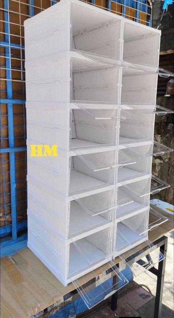 Stackable Shoe Storage Boxes - White, Clear Front (Category: Storage Boxes & Baskets) located in Caloocan City. Submitted by swiftflower_802790 (Listing ID 1459189207, Image 2). Description: - Set of stackable storage boxes - White frame with clear drop-front doors - Ideal for shoes, accessories, or other items - Easy to assemble and stack - Folds flat for convenient storage when not in use - Approximate dimensions: 26.4cm (L) x 17cm (W) x 34.5cm