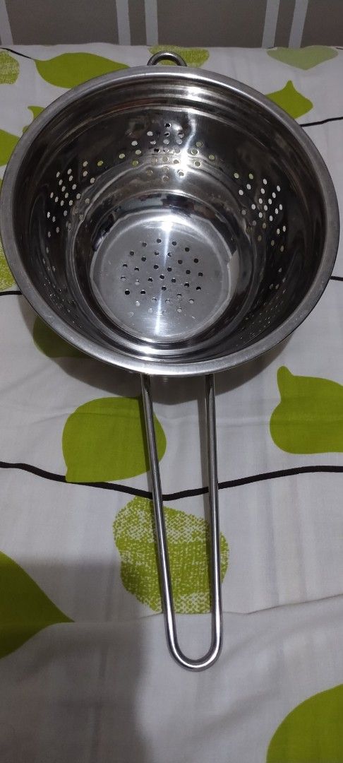 Stainless Steel Colander with Handles (Category: Cookware & Accessories) located in Makati City. Submitted by chamarket.2022 (Listing ID 1459219377, Image 2). Description: Restaurant-grade stainless steel colander. It has a handle for easy carrying. The sides and bottom have many small holes for draining. Great for washing fruits and vegetables or draining pasta. Sturdy construction. Ready for your kitchen. Features: * Weight: 0.40kg * Diameter: 