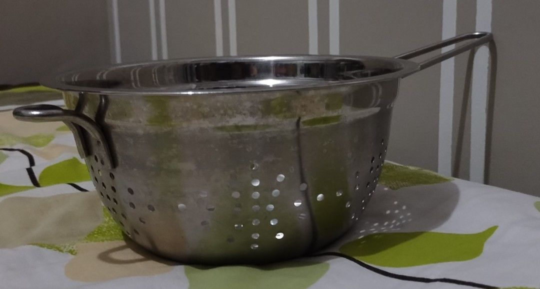 Stainless Steel Colander with Handles (Category: Cookware & Accessories) located in Makati City. Submitted by chamarket.2022 (Listing ID 1459219377, Image 1). Description: Restaurant-grade stainless steel colander. It has a handle for easy carrying. The sides and bottom have many small holes for draining. Great for washing fruits and vegetables or draining pasta. Sturdy construction. Ready for your kitchen. Features: * Weight: 0.40kg * Diameter: 