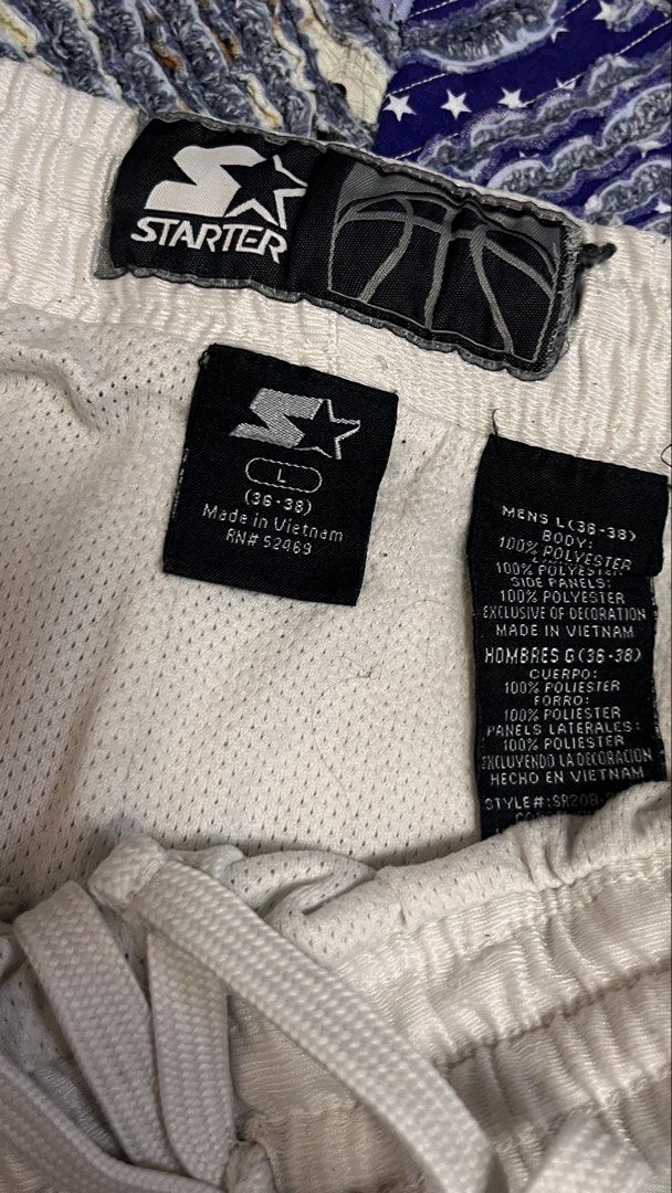 Starter White Athletic Shorts Size L (36-38) (Category: Shorts) located in Cabuyao City. Submitted by bulandos (Listing ID 1459249589, Image 3). Description: - Brand: Starter - Size: L (fits waist 36-38 inches) - Color: White with yellow and navy blue side accents - Material: Polyester - Features: Elastic waistband with drawstring - Ideal for: Sports and casual wear - Origin: Made in Vietnam.