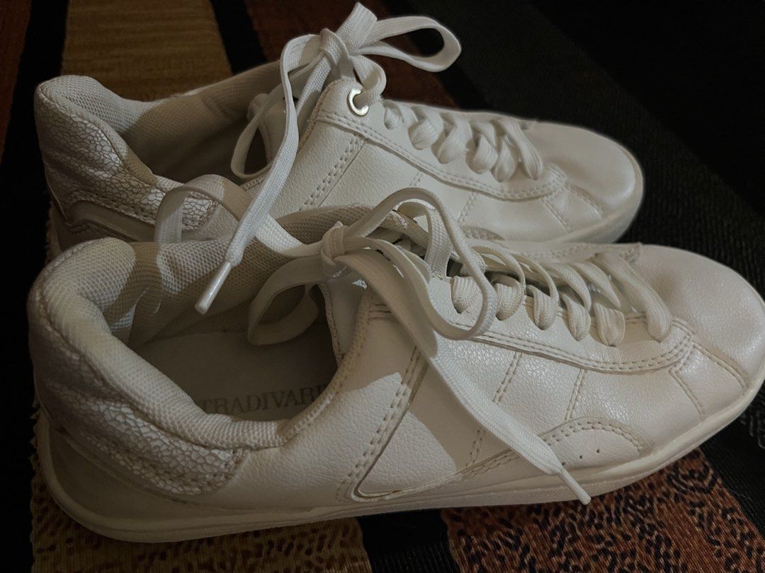 Stradivarius White Leather Lace-Up Sneakers (Category: Sneakers) located in Manila. Submitted by whims.closet (Listing ID 1459168069, Image 2). Description: - Classic white sneakers from Stradivarius - Simple and versatile design, pairs easily with any outfit - Secure lace-up closure - Brand name visible on inner sole - Ideal for everyday wear.