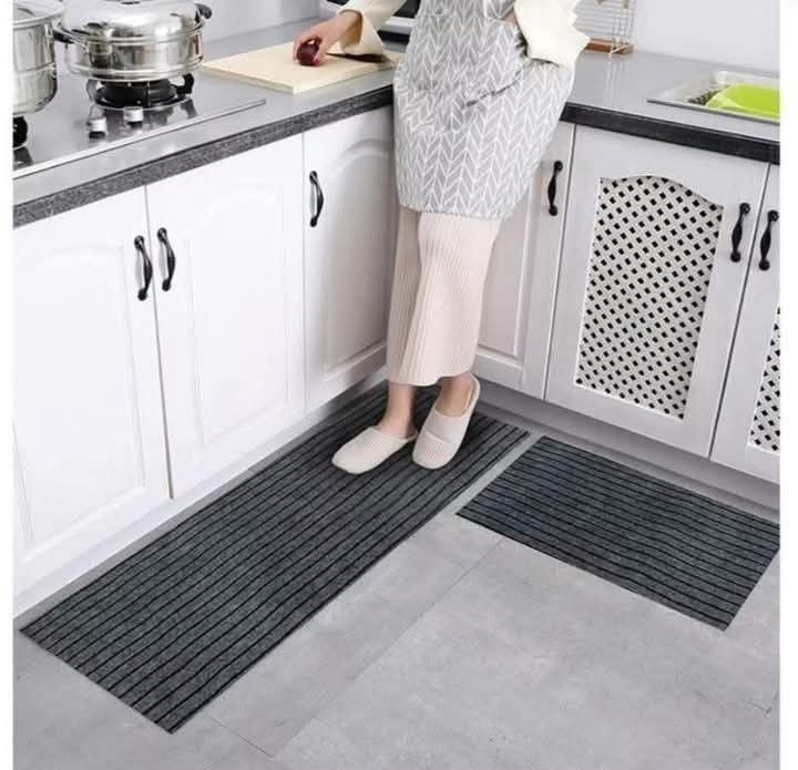 Striped Kitchen Runner Rug Set - 2 Pieces (Category: Carpets, Mats & Flooring) located in Caloocan City. Submitted by swiftflower_802790 (Listing ID 1459188524, Image 1). Description: - Set includes one long runner and one smaller mat. - Features a classic striped pattern. - Available in three stylish colors: grey, maroon, or brown. - Ideal for use in the kitchen or entryway. - Easy to clean and maintain. - Helps protect your floors from spills a