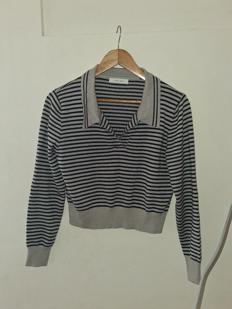 Striped Knit Sweater with Collar (Category: Longsleeves) located in Manila. Submitted by kxkcx (Listing ID 1459126899, Image 1). Description: - Grey and navy striped knit sweater - Features a stylish collar detail - Long sleeves with ribbed cuffs - Fine and even knit for a comfortable feel - Versatile for layering or wearing on its own - Ideal for casual outfits.