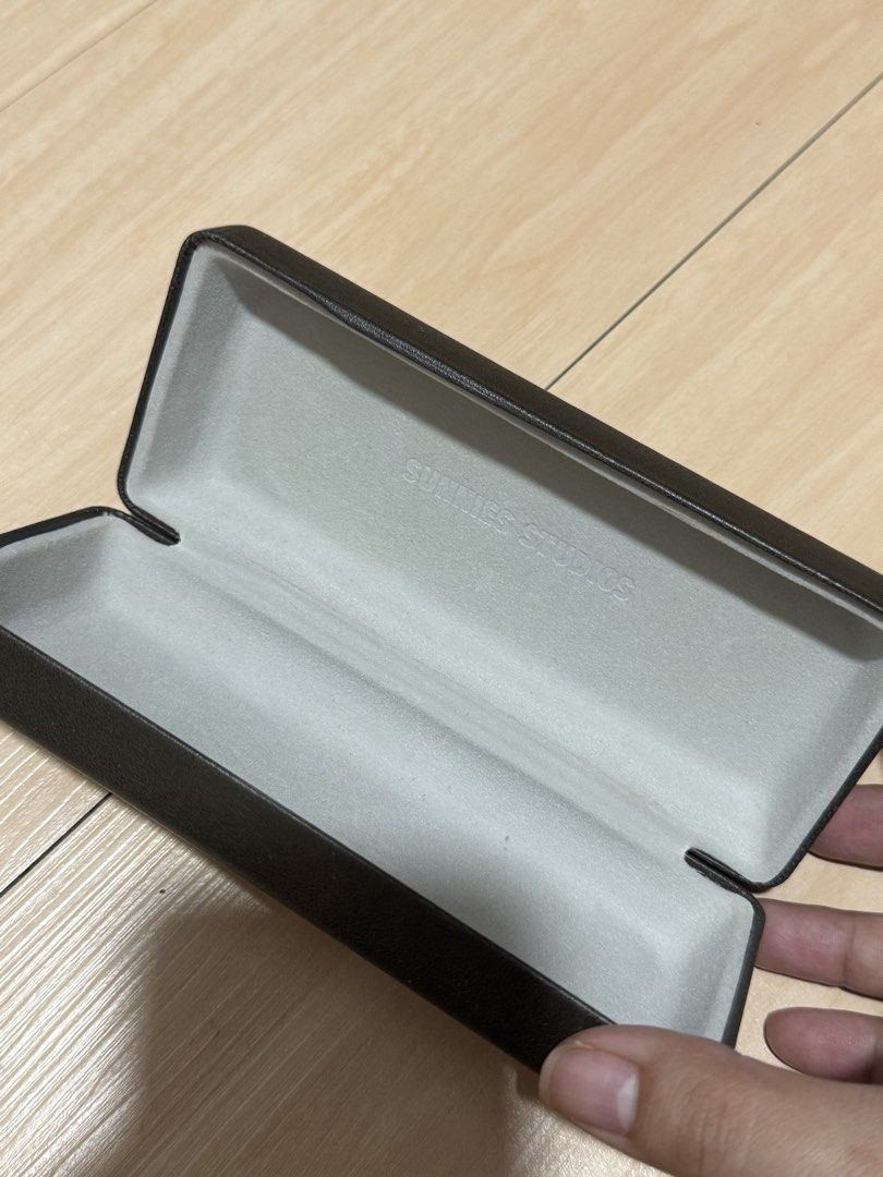 Sunnies Studios Glasses Case (Category: Sunglasses & Eyewear) located in Manila. Submitted by sumisloveditems (Listing ID 1459268869, Image 3). Description: ₱150 Black hard case for glasses - Features Sunnies Studios logo on the front - Lined with soft material inside - Provides excellent protection for your eyewear - Perfect for travel or everyday storage.