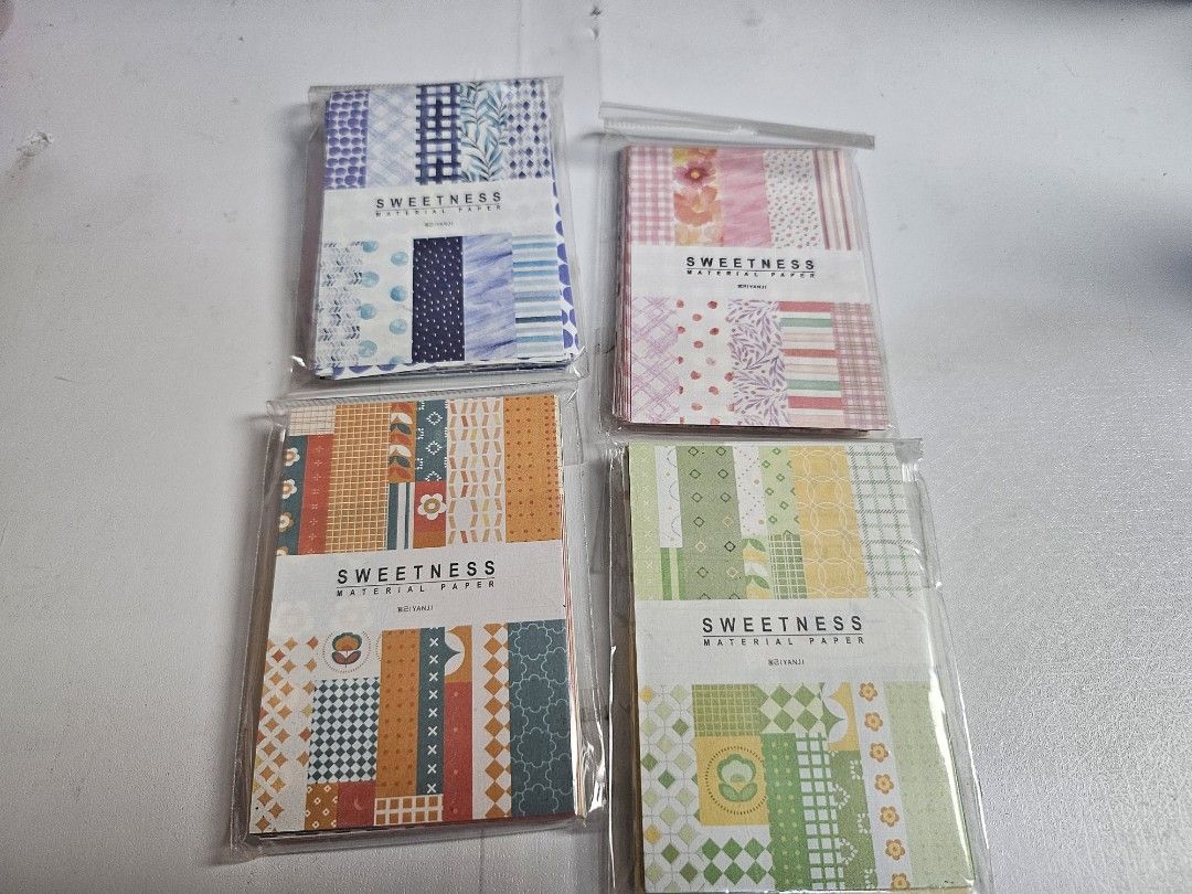 Sweetness Material Paper Set - 4 Packs (Category: Craft Supplies & Tools) located in Pasig City. Submitted by purplewingsph1 (Listing ID 1459089578, Image 1). Description: - Set of 4 Sweetness Material Paper packs - Perfect for journaling, scrapbooking, and decorating - Designs include: blue floral, pink floral, orange geometric, and green geometric Condition: Slightly new PAYO Only. Strictly no COD. (Please view my Carousell profile for proof of