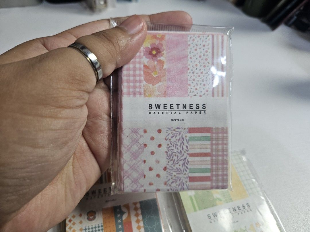 Sweetness Material Paper Set - 4 Packs (Category: Craft Supplies & Tools) located in Pasig City. Submitted by purplewingsph1 (Listing ID 1459089578, Image 3). Description: - Set of 4 Sweetness Material Paper packs - Perfect for journaling, scrapbooking, and decorating - Designs include: blue floral, pink floral, orange geometric, and green geometric Condition: Slightly new PAYO Only. Strictly no COD. (Please view my Carousell profile for proof of
