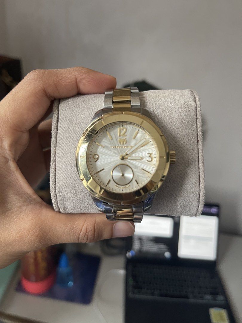 TechnoMarine MoonSun Two-Tone Watch (Category: Women's Watches) located in Quezon City. Submitted by zenwolf_4b0618 (Listing ID 1459120842, Image 1). Description: - Stylish two-tone design (gold and silver accents) - Classic white dial with subtle texture - Functional small seconds subdial at 6 o'clock - Durable stainless steel band with secure fold-over clasp - Water resistant for everyday peace of mind - Versatile for both casual and formal wea