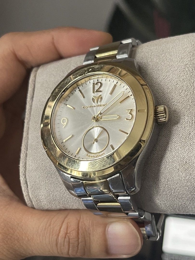 TechnoMarine MoonSun Two-Tone Watch (Category: Women's Watches) located in Quezon City. Submitted by zenwolf_4b0618 (Listing ID 1459120842, Image 3). Description: - Stylish two-tone design (gold and silver accents) - Classic white dial with subtle texture - Functional small seconds subdial at 6 o'clock - Durable stainless steel band with secure fold-over clasp - Water resistant for everyday peace of mind - Versatile for both casual and formal wea