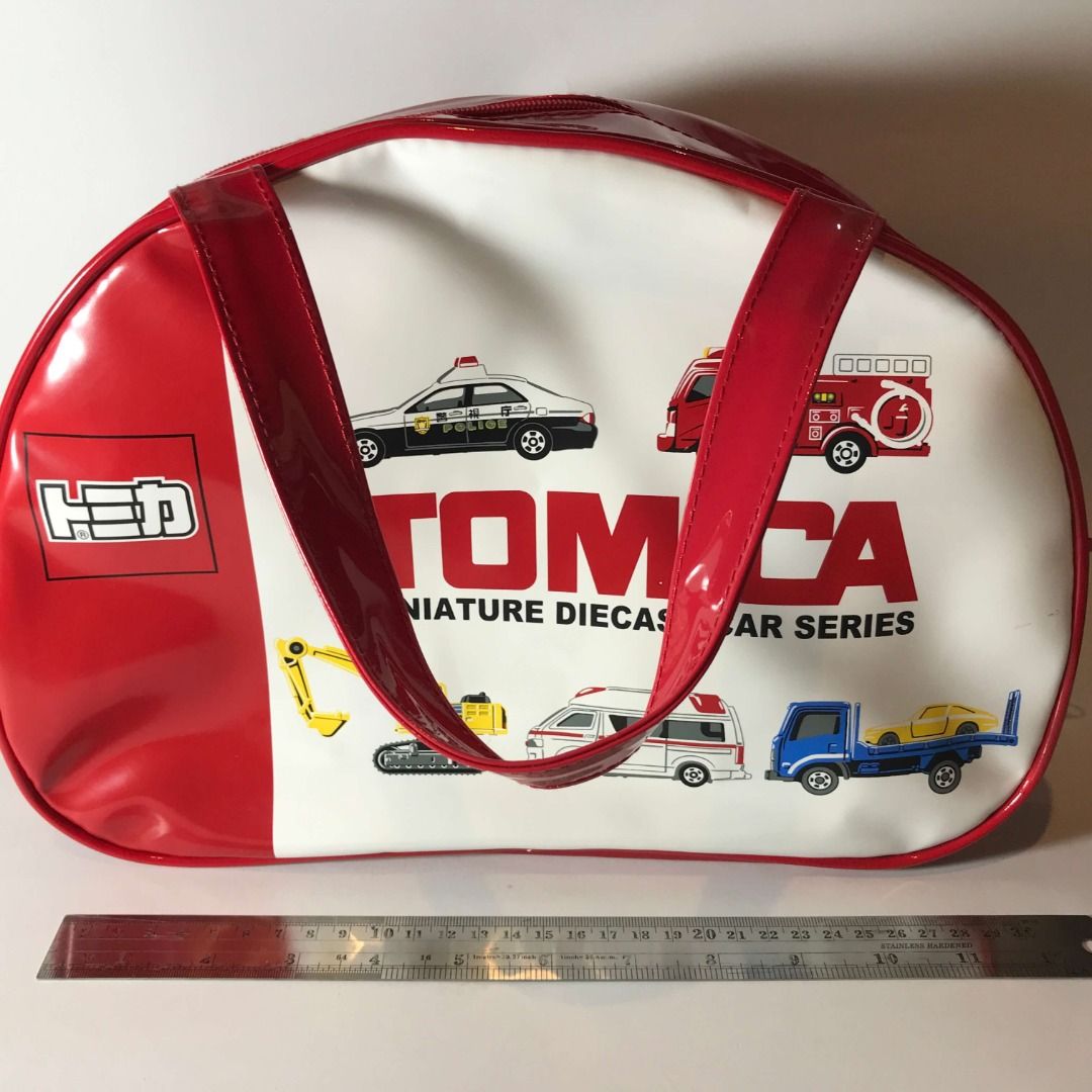 Tomica Red Hand Bag Red Moririn (Category: Belt bags, Clutches and Pouches) located in Caloocan City. Submitted by mack_collectibles (Listing ID 1459190495, Image 2). Description: Authentic Tomica Red Hand Bag Red Moririn 100% Authentic from Japan Good condition Secondhand, expect scratches and paint transfer NO.17T700SM • Size: 13 inches length x 9 inches height • Manufacturer: Moririn • Release date: 2017 or 2018? Battery (5cm) for size compari