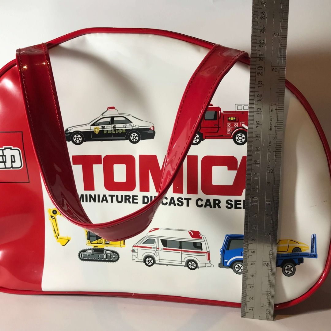 Tomica Red Hand Bag Red Moririn (Category: Belt bags, Clutches and Pouches) located in Caloocan City. Submitted by mack_collectibles (Listing ID 1459190495, Image 3). Description: Authentic Tomica Red Hand Bag Red Moririn 100% Authentic from Japan Good condition Secondhand, expect scratches and paint transfer NO.17T700SM • Size: 13 inches length x 9 inches height • Manufacturer: Moririn • Release date: 2017 or 2018? Battery (5cm) for size compari