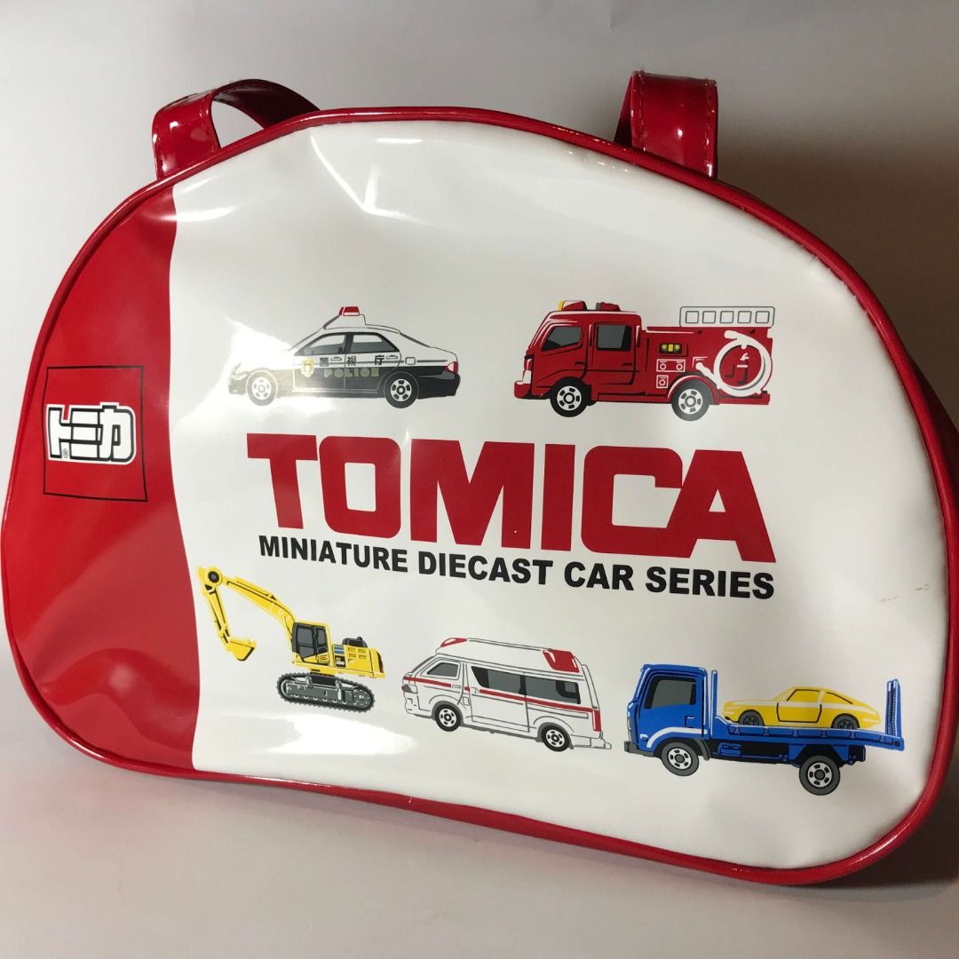 Tomica Red Hand Bag Red Moririn (Category: Belt bags, Clutches and Pouches) located in Caloocan City. Submitted by mack_collectibles (Listing ID 1459190495, Image 1). Description: Authentic Tomica Red Hand Bag Red Moririn 100% Authentic from Japan Good condition Secondhand, expect scratches and paint transfer NO.17T700SM • Size: 13 inches length x 9 inches height • Manufacturer: Moririn • Release date: 2017 or 2018? Battery (5cm) for size compari