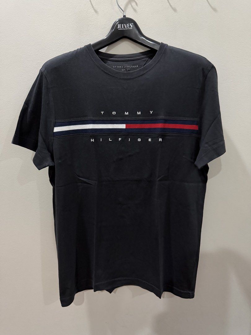 Tommy Hilfiger T-Shirt (Category: Tshirts & Polo Shirts ) located in Pasig City. Submitted by dey2x (Listing ID 1459259522, Image 1). Description: RFS: decluttering -Meetups can be arranged -Delivery via Grab Express/Lalamove/J&T/LBC (c/o buyer) PLEASE TAKE NOTE: This is preowned. Expect signs of usage. NO RETURN POLICY. NO EXCHANGE OF ITEMS..