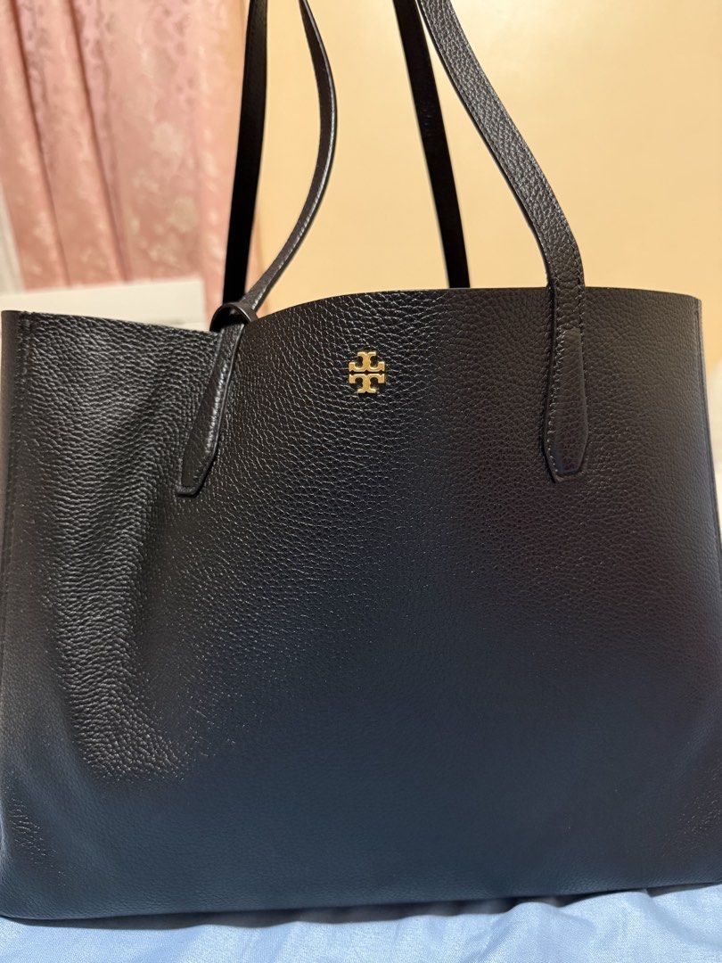 Tory Burch Black Leather Tote Bag (Category: Luxury Bags & Wallets) located in Cebu City. Submitted by jocapin32 (Listing ID 1459139911, Image 2). Description: - Classic black Tory Burch tote bag - Pebbled leather exterior - Gold Tory Burch logo on front - Spacious interior for essentials - Made in Cambodia - Date code: 09-21.
