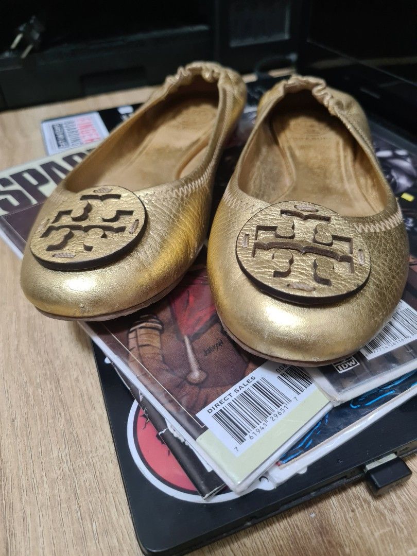 Tory Burch Gold Ballet Flats (Category: Flats & Sandals) located in Manila. Submitted by sevyaleinad (Listing ID 1459225692, Image 2). Description: - Gold Tory Burch ballet flats - Classic design with signature Tory Burch logo - Comfortable slip-on style - Perfect for everyday wear or elevating any outfit.