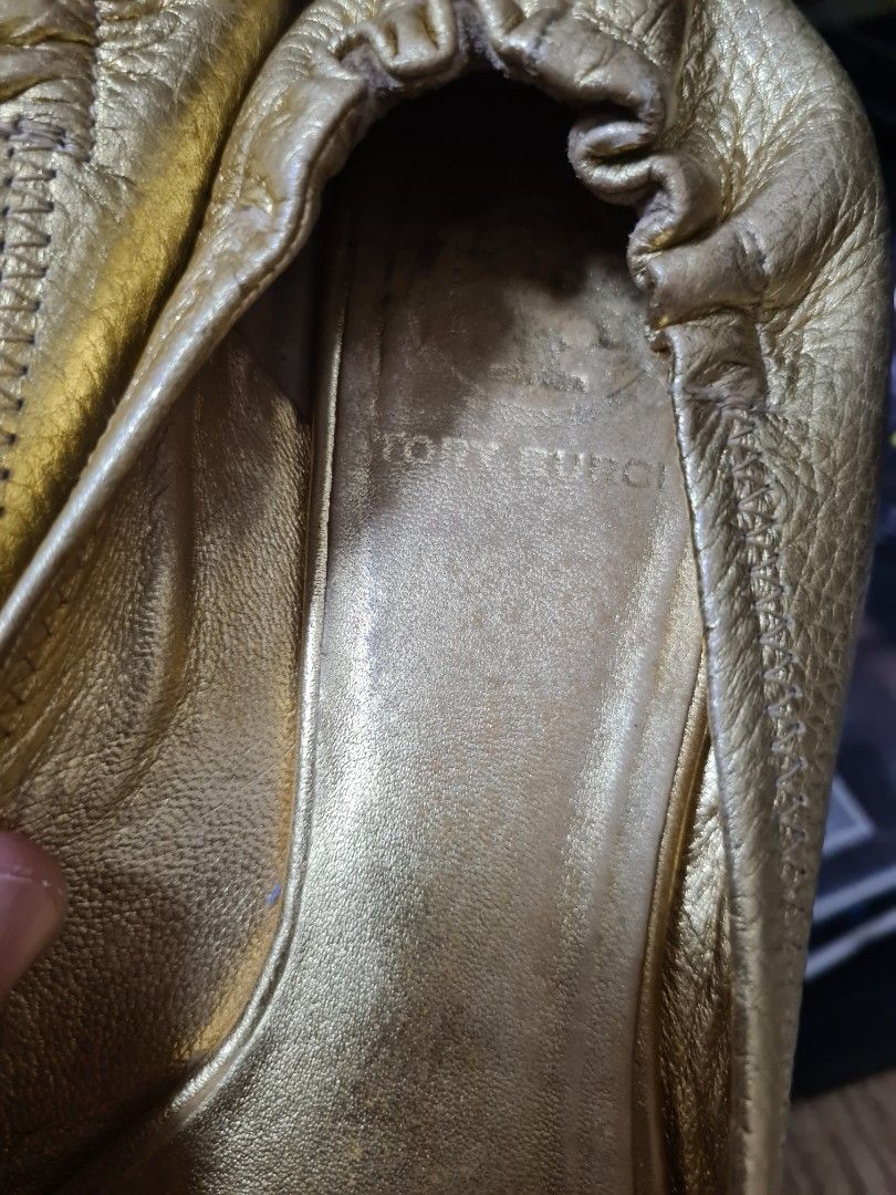 Tory Burch Gold Ballet Flats (Category: Flats & Sandals) located in Manila. Submitted by sevyaleinad (Listing ID 1459225692, Image 3). Description: - Gold Tory Burch ballet flats - Classic design with signature Tory Burch logo - Comfortable slip-on style - Perfect for everyday wear or elevating any outfit.