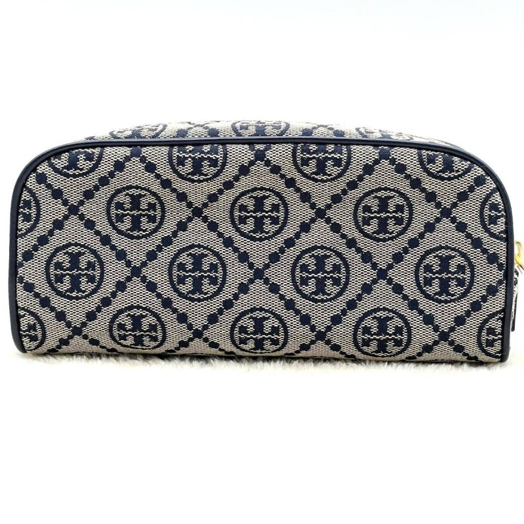 Tory Burch T Monogram Jacquard cosmetic case (Category: Luxury Bags & Wallets) located in Manila. Submitted by fashionistaandglamourozafh (Listing ID 1459108175, Image 3). Description: This is a Tory Burch T Monogram Jacquard cosmetic case featuring a woven navy blue pattern and smooth leather trim ETA: 15days.