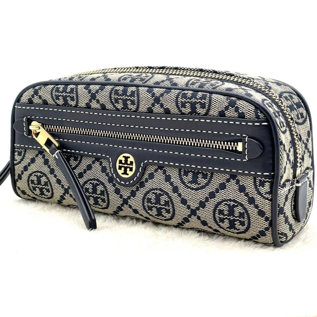 Tory Burch T Monogram Jacquard cosmetic case (Category: Luxury Bags & Wallets) located in Manila. Submitted by fashionistaandglamourozafh (Listing ID 1459108175, Image 1). Description: This is a Tory Burch T Monogram Jacquard cosmetic case featuring a woven navy blue pattern and smooth leather trim ETA: 15days.