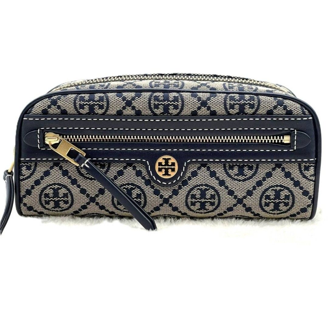 Tory Burch T Monogram Jacquard cosmetic case (Category: Luxury Bags & Wallets) located in Manila. Submitted by fashionistaandglamourozafh (Listing ID 1459108175, Image 2). Description: This is a Tory Burch T Monogram Jacquard cosmetic case featuring a woven navy blue pattern and smooth leather trim ETA: 15days.