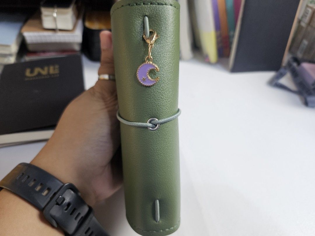 Travellers Journal (Category: Stationery & School Supplies) located in Pasig City. Submitted by purplewingsph1 (Listing ID 1459108912, Image 2). Description: - Olive Green PU Leather Journal Cover with Moon Charm - Secure elastic closure - Adorable moon and heart charms included - Internal pen slot and card holder - Comes with a lined, dotted, and grid notebooks - Ideal for daily journaling, planning, and note-taking PAYO Only. Strictly no COD. (
