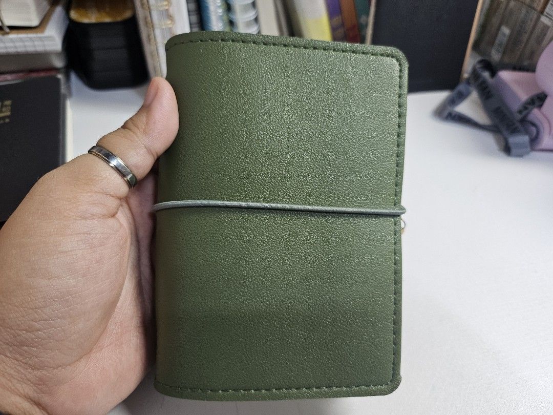 Travellers Journal (Category: Stationery & School Supplies) located in Pasig City. Submitted by purplewingsph1 (Listing ID 1459108912, Image 1). Description: - Olive Green PU Leather Journal Cover with Moon Charm - Secure elastic closure - Adorable moon and heart charms included - Internal pen slot and card holder - Comes with a lined, dotted, and grid notebooks - Ideal for daily journaling, planning, and note-taking PAYO Only. Strictly no COD. (