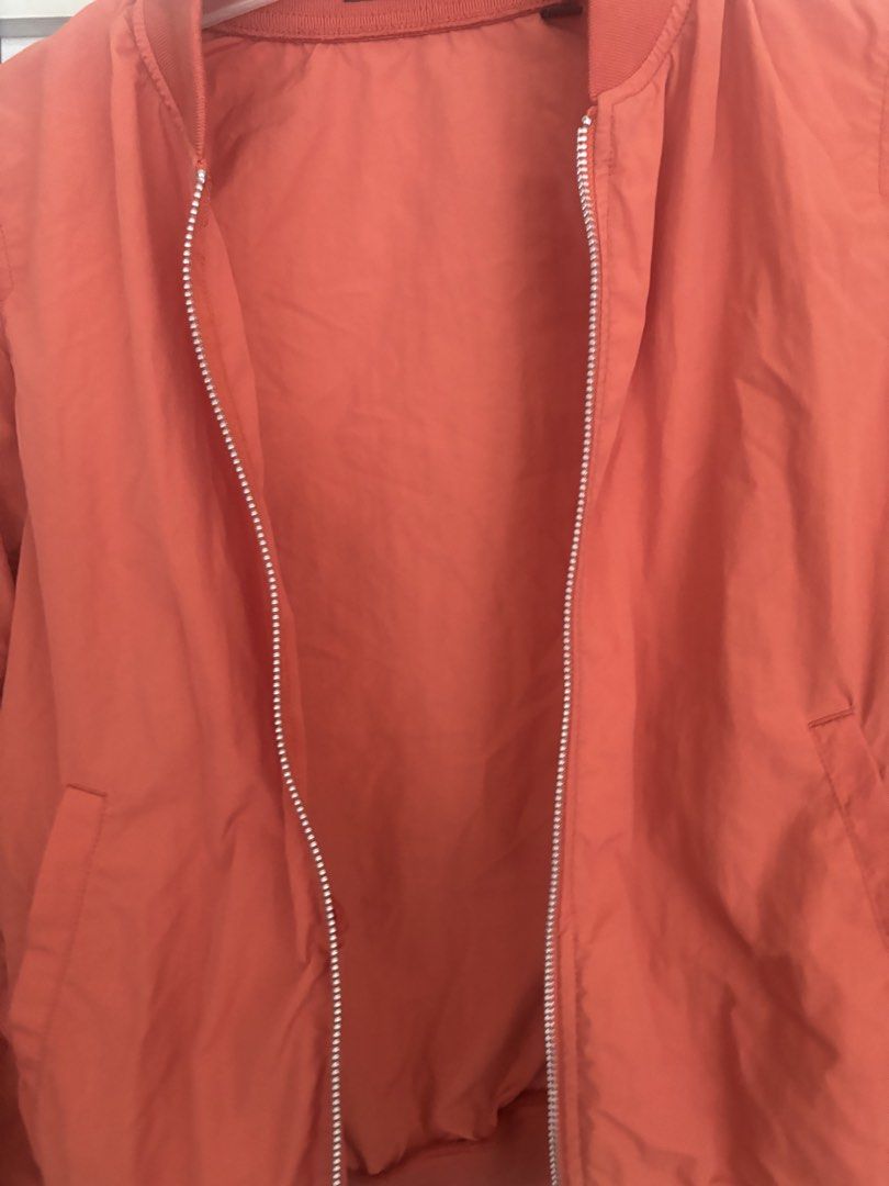 Uniqlo Orange Bomber Jacket (Category: Coats, Jackets and Outerwear) located in Cainta. Submitted by doverparfum (Listing ID 1459107066, Image 3). Description: - Orange bomber jacket - Zip-up front with pockets - Ribbed cuffs and hem - Lightweight material - Great for layering - Easy to style.