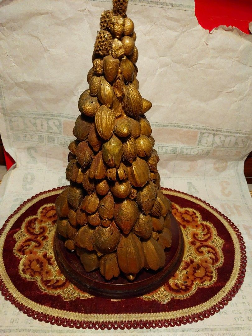 Unique Gold Nut and Seed Decorative Tree (Category: Other Home Decor) located in Manila. Submitted by bryantoyshop (Listing ID 1459249056, Image 3). Description: - Handmade decorative tree - Covered in various nuts and seeds, all painted gold - Sits on a wooden base with a decorative mat - Unique piece for home decor - Great conversation starter - Measures approximately 11 inches tall.