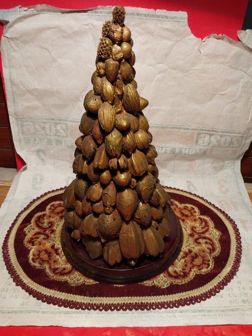 Unique Gold Nut and Seed Decorative Tree (Category: Other Home Decor) located in Manila. Submitted by bryantoyshop (Listing ID 1459249056, Image 1). Description: - Handmade decorative tree - Covered in various nuts and seeds, all painted gold - Sits on a wooden base with a decorative mat - Unique piece for home decor - Great conversation starter - Measures approximately 11 inches tall.