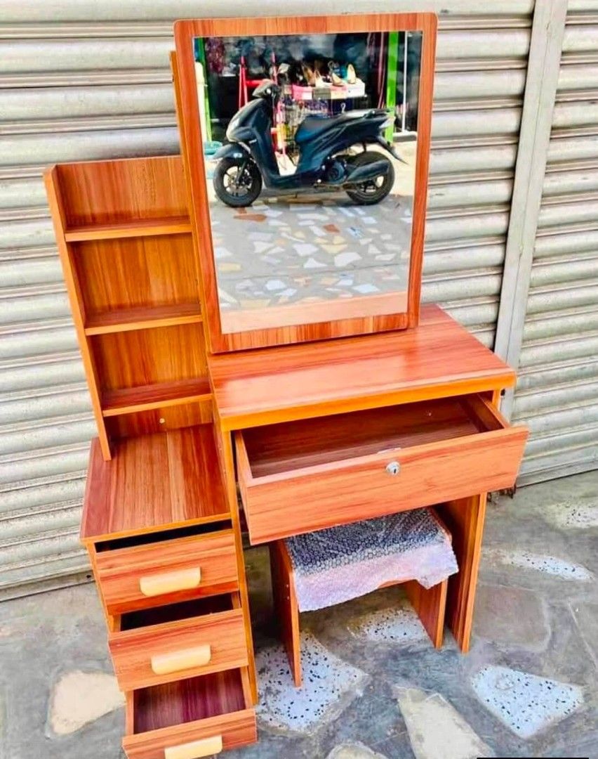 Vanity Table with Mirror, Stool, and Storage (Category: Tables & Sets) located in Caloocan City. Submitted by swiftflower_802790 (Listing ID 1459188873, Image 1). Description: - Complete dressing table set with mirror and matching stool. - Ample storage with built-in shelves and drawers. - Organize your makeup and accessories with ease. - Available in a variety of attractive colors. - Compact design ideal for bedrooms of all sizes..