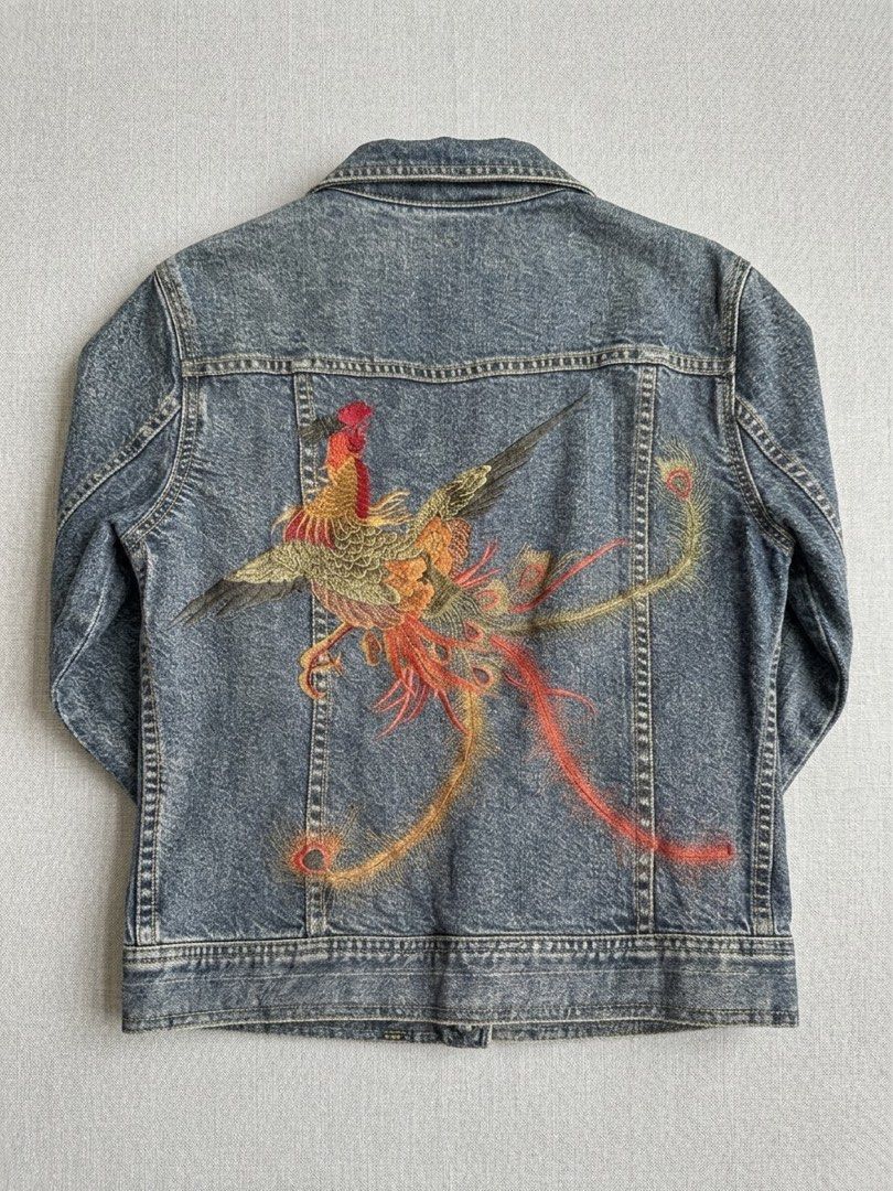 DKNY Vintage Denim Jacket with Embroidered Phoenix (Category: Coats, Jackets and Outerwear) located in Manila. Submitted by oja02 (Listing ID 1459284427, Image 2). Description: Vintage DKNY denim jacket Size 6 Embroidered phoenix design on the back Classic button up closure Two front pockets Location: Manila.