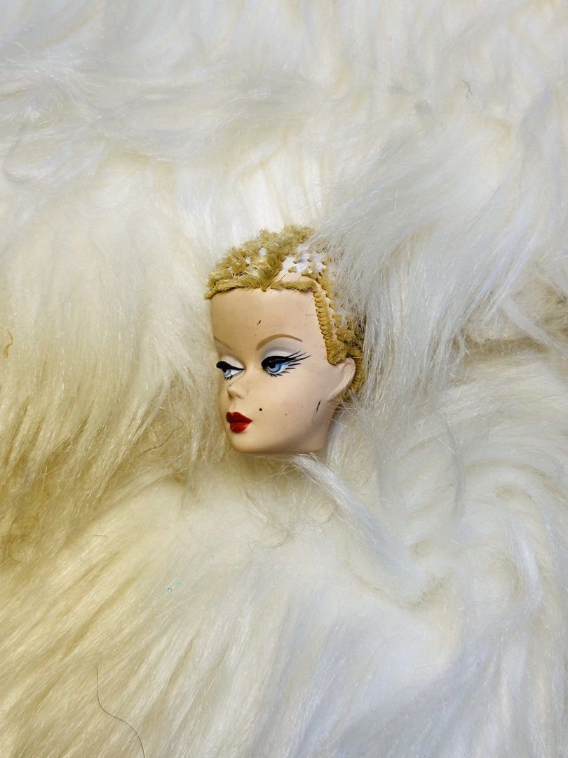 Vintage Mattel 1958 Doll Head (Category: Kids Toys) located in Santa Maria. Submitted by houseofluckytoystore (Listing ID 1459092061, Image 3). Description: - Vintage Mattel doll head - Dated 1958 - Blonde, styled hair - Blue eyes with detailed makeup (eyeliner, lashes) - Red lips with beauty mark - Ideal for collectors, display, or replacement parts barbie silkstone Pre-Loved toys and signs of usage Issue there hole on the head what you see is w