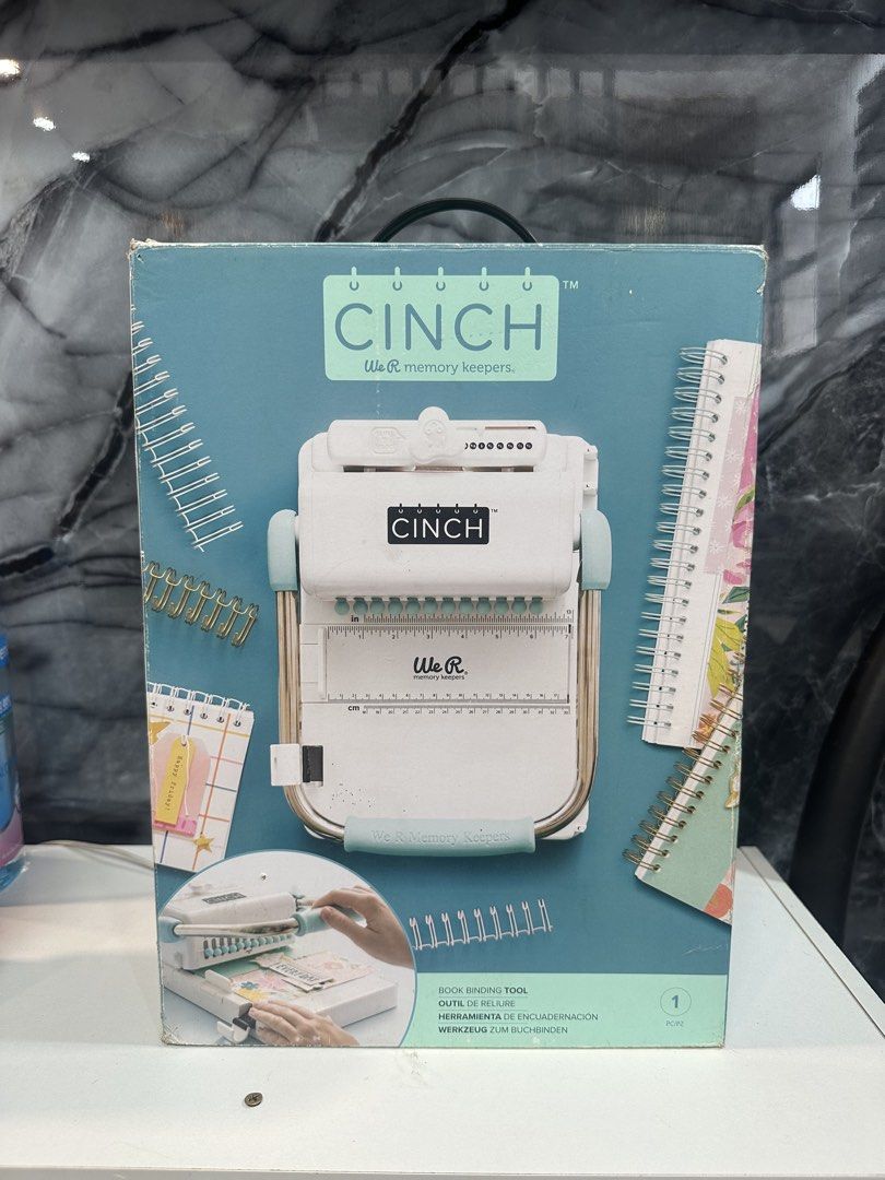 We R Memory Keepers Cinch V2 White Mint Book Binding Tool (Category: Craft Supplies & Tools) located in Lipa City. Submitted by kiangkong (Listing ID 1459171277, Image 3). Description: - We R Memory Keepers Cinch V2 book binding tool - Color: White and Mint - Create custom books and journals - Easily punch holes and bind pages - Includes original box - Ideal for crafting and scrapbooking projects.