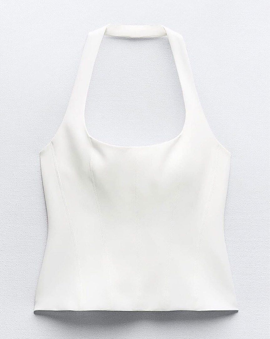 White Halter Neck Corset Top (Category: Sleeveless) located in Bulacan. Submitted by declutterwithcloudy (Listing ID 1459217437, Image 1). Description: - White halter neck top - Corset style - Versatile: perfect for dressing up or down - Comfortable material for all-day wear.