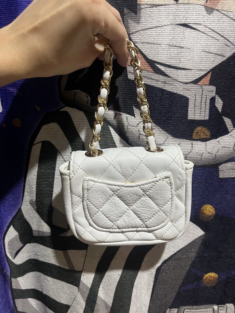White Quilted Chain hand Bag — mini (Category: Shoulder Bags) located in Manila. Submitted by schwarzer0 (Listing ID 1459149377, Image 2). Description: - Cute white quilted bag - Gold chain strap - Flap closure with gold clasp - Small pocket on the back - Ideal for carrying essentials - Matches with many outfits.