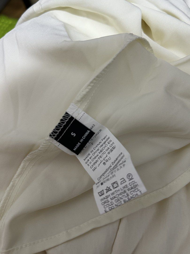 White Tiered Maxi Dress with Spaghetti Straps (Category: Dresses) located in Pasay City. Submitted by annwops (Listing ID 1459262902, Image 3). Description: - White tiered maxi dress - Spaghetti straps with adjustable length - Slight textured fabric - Ideal for casual outings or beach days - Versatile for dressing up or down - Size S.