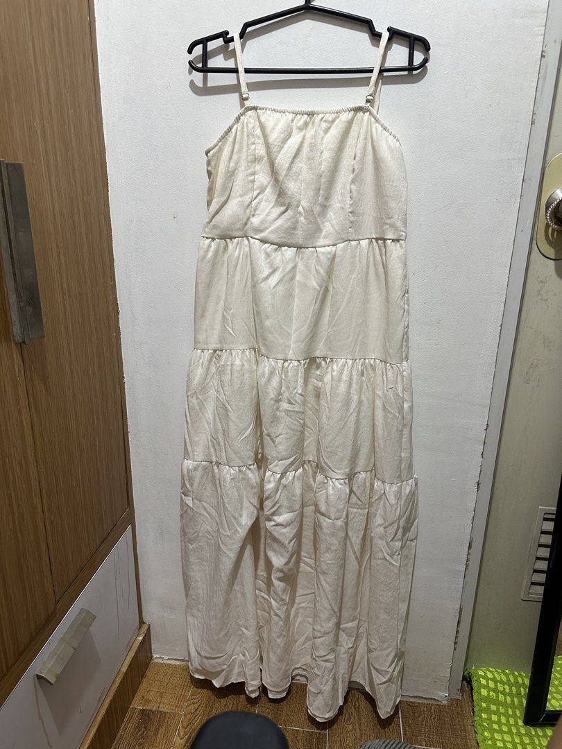 White Tiered Maxi Dress with Spaghetti Straps (Category: Dresses) located in Pasay City. Submitted by annwops (Listing ID 1459262902, Image 1). Description: - White tiered maxi dress - Spaghetti straps with adjustable length - Slight textured fabric - Ideal for casual outings or beach days - Versatile for dressing up or down - Size S.