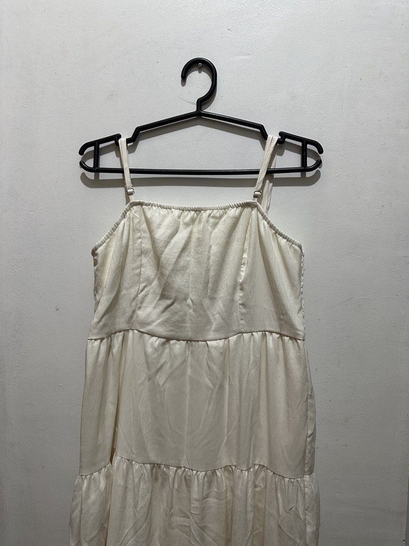 White Tiered Maxi Dress with Spaghetti Straps (Category: Dresses) located in Pasay City. Submitted by annwops (Listing ID 1459262902, Image 2). Description: - White tiered maxi dress - Spaghetti straps with adjustable length - Slight textured fabric - Ideal for casual outings or beach days - Versatile for dressing up or down - Size S.