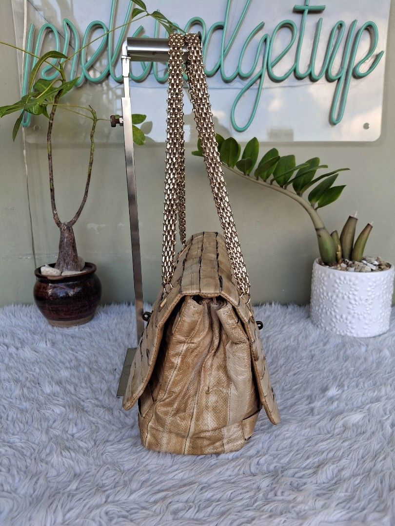 Woven Genuine Exotic Eel Leather Shoulder Bag with Chain Strap (Category: Shoulder Bags) located in Mandaluyong City. Submitted by shams2026 (Listing ID 1459121829, Image 3). Description: - Light tan woven leather bag - Back to back double faced bag - 2 compartments - All-over woven texture - Secure metal clasp closure - Interior has a few small marks - Ideal for evening wear and special occasions or everyday OOTD bag - Japan sourced exotic leath