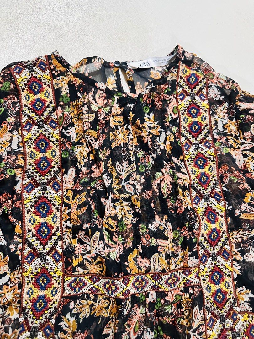 Zara Floral Print Sheer Blouse (Category: Blouses) located in Manila. Submitted by oja02 (Listing ID 1459252711, Image 2). Description: Zara sheer blouse Lightweight fabric Beaded. Geometric aztec style Size: Xs but can fit up to Medium Loc: Manila.