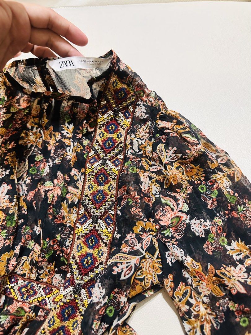 Zara Floral Print Sheer Blouse (Category: Blouses) located in Manila. Submitted by oja02 (Listing ID 1459252711, Image 3). Description: Zara sheer blouse Lightweight fabric Beaded. Geometric aztec style Size: Xs but can fit up to Medium Loc: Manila.