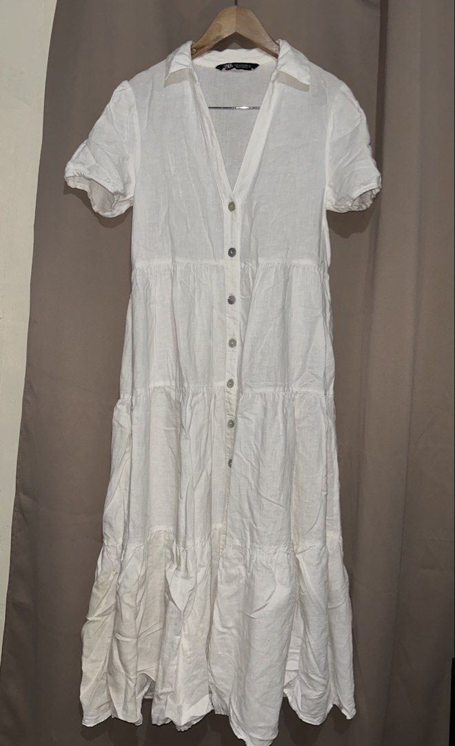Zara White Linen Tiered Button-Down Maxi Dress (Category: Dresses) located in San Jose. Submitted by abbsc. (Listing ID 1459200801, Image 1). Description: - Zara white linen maxi dress - Short sleeves - Collared neckline - Button-down front with shell buttons - Tiered skirt design - Maxi length - Xs-small - Relaxed fit.