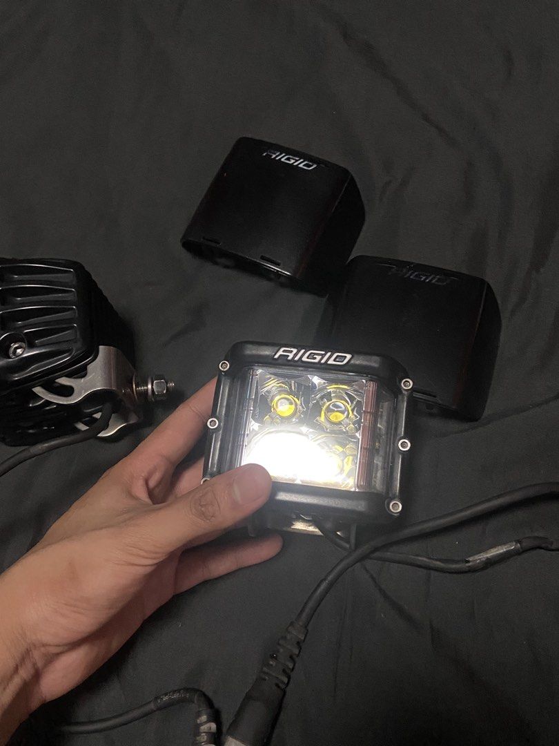 2x RIGID D-SS Series LED Lights with Covers (Category: Body Parts and Accessories) located in Caloocan City. Submitted by wayneitems (Listing ID 1462943538, Image 3). Description: - RIGID D-SS Series LED Lights (Pair) - Cube style with 4 LEDs per light - Includes two black RIGID covers - Ideal for off-road vehicles and trucks - Wiring included - Sold as a set.